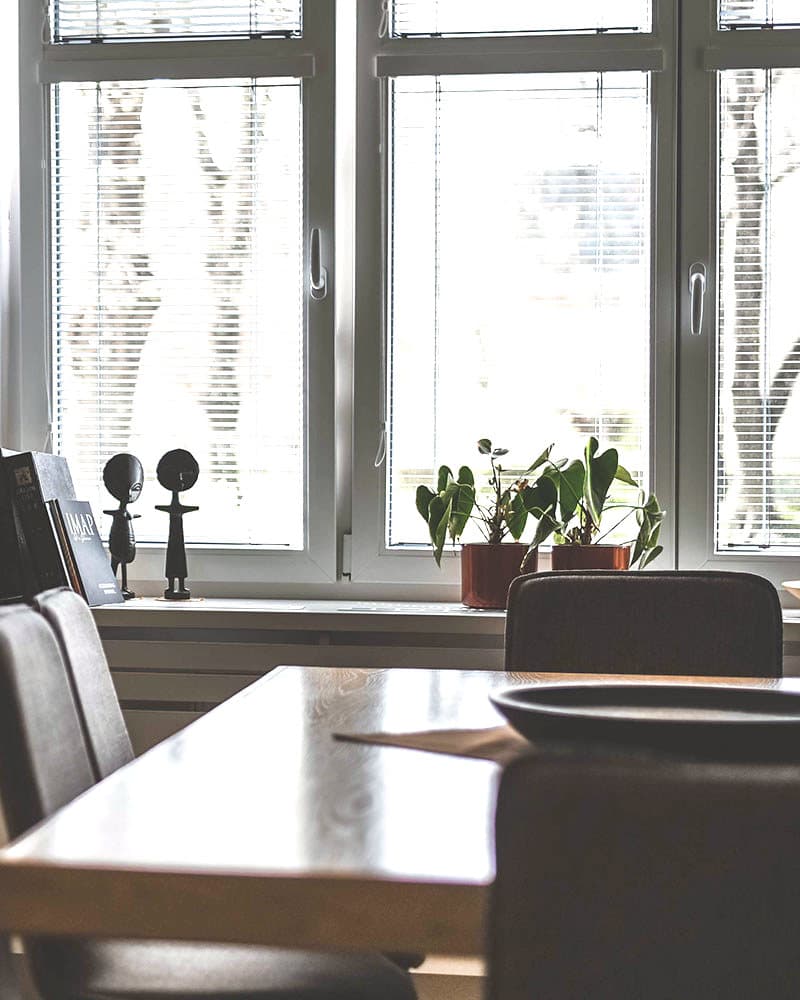 The firm's meeting room with a table by a large window